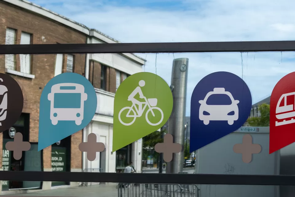Sign with icons indicating access to multiple transportation modes in Le Havre, France